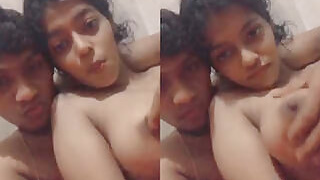 Indian guy plays with a girl's tiny tits on camera